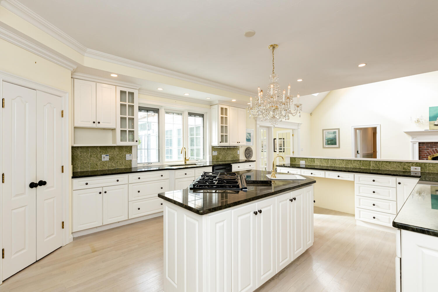 47 Farm Valley Road Osterville, MA 02655 - Photo 20 of 57 a kitchen with granite countertop a sink stove and white cabinets