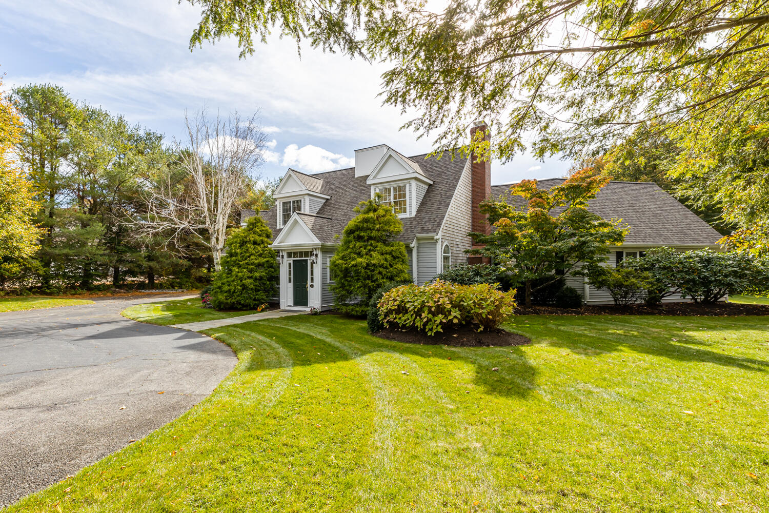 47 Farm Valley Road Osterville, MA 02655 - Photo 4 of 57 a view of a house with a yard and a garage