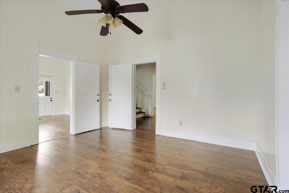 310 East 3rd Street Mount Pleasant, TX 75455 - Photo 17 of 35 a view of an empty room and wooden floor