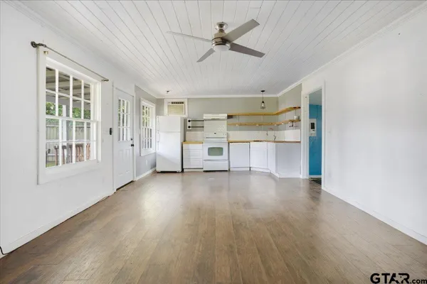 a view of an empty room with a window