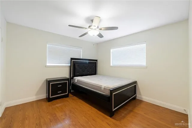 a room with a bed and a tv