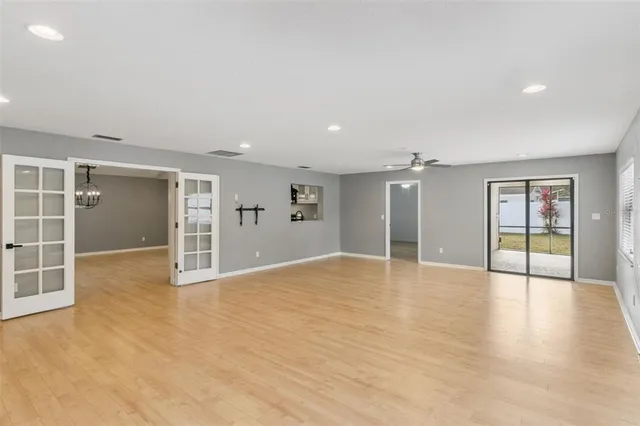 a view of a swimming pool with a yard