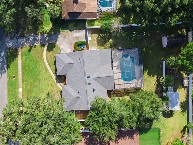a view of a dining room with furniture wooden floor and chandelier