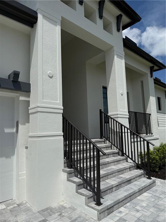 82 Tahiti Road Marco Island, FL 34145 - Photo 2 of 27 a view of a house with wooden floor and wooden fence