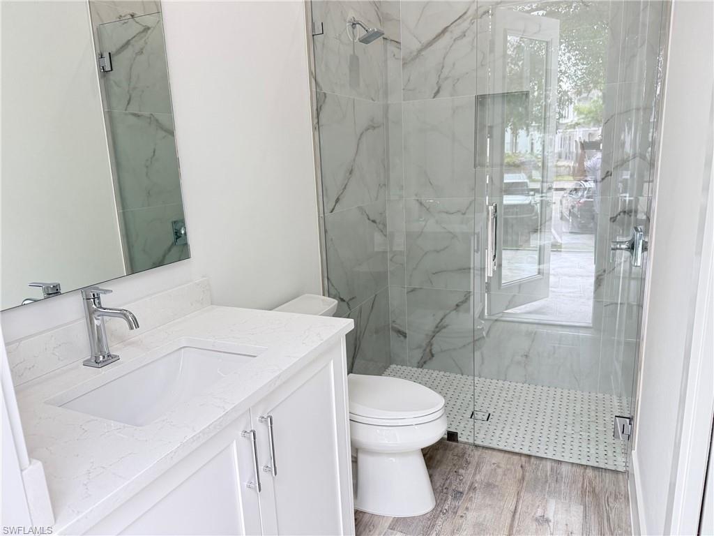 82 Tahiti Road Marco Island, FL 34145 - Photo 24 of 27 a bathroom with a sink toilet and shower