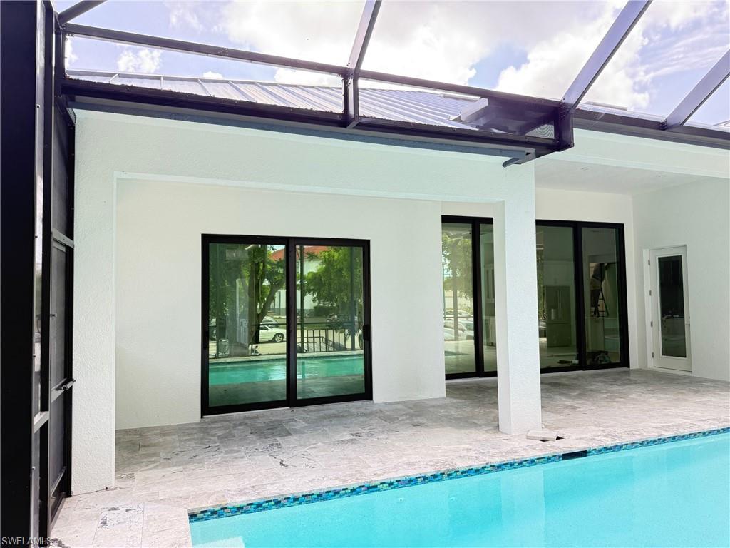 82 Tahiti Road Marco Island, FL 34145 - Photo 4 of 27 a front view of a house with a porch