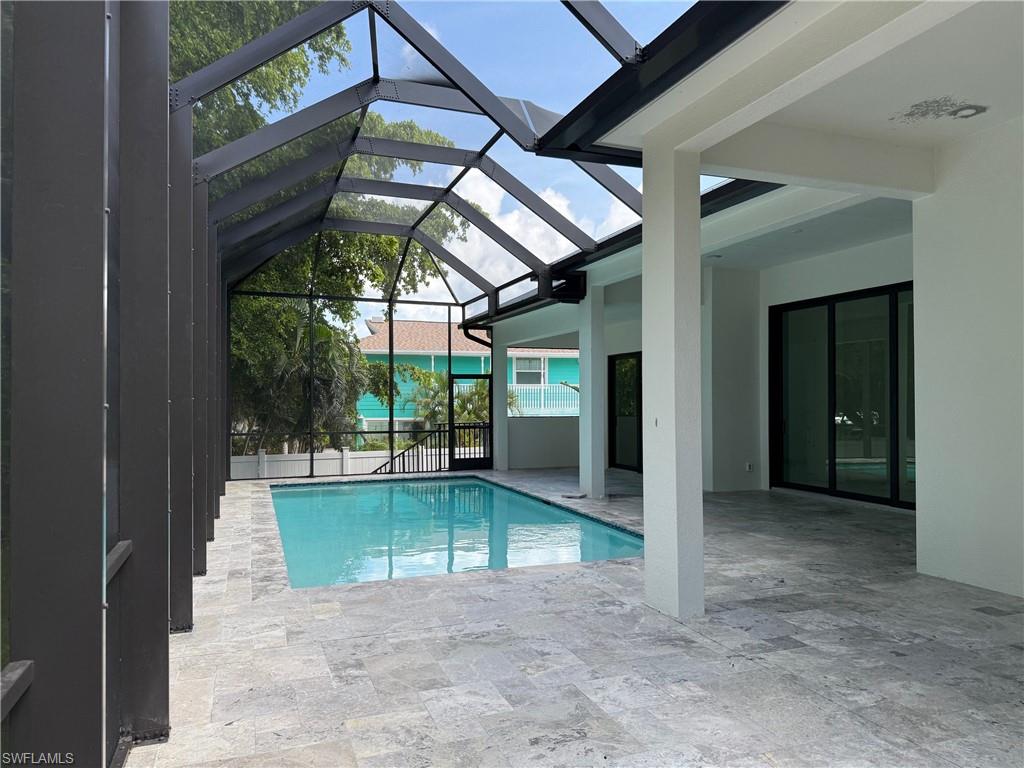 82 Tahiti Road Marco Island, FL 34145 - Photo 5 of 27 a view of a porch with a backyard