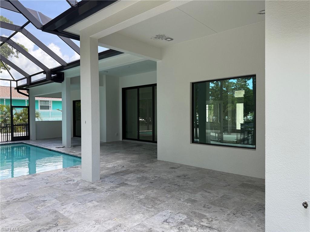 82 Tahiti Road Marco Island, FL 34145 - Photo 6 of 27 an empty room with windows