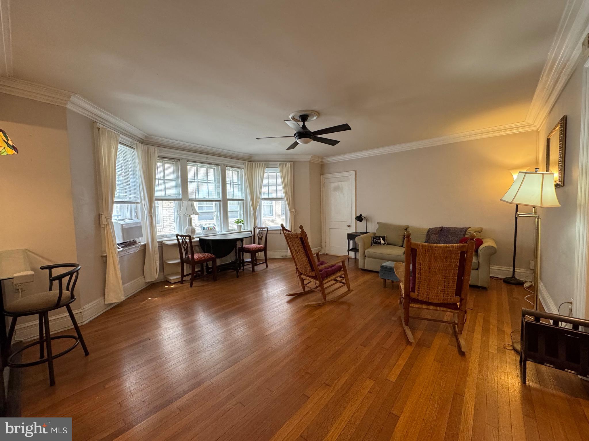 4643 Pine Street, Unit C411 Philadelphia, PA 19143 - Photo 23 of 60 a living room with furniture and a large window