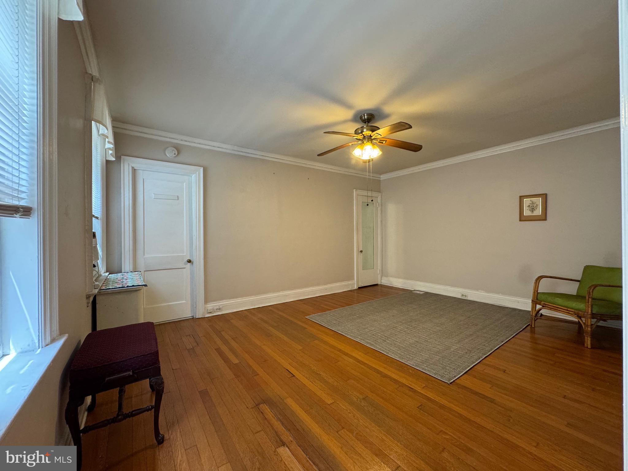 4643 Pine Street, Unit C411 Philadelphia, PA 19143 - Photo 30 of 60 a view of livingroom with hardwood floor and dining table