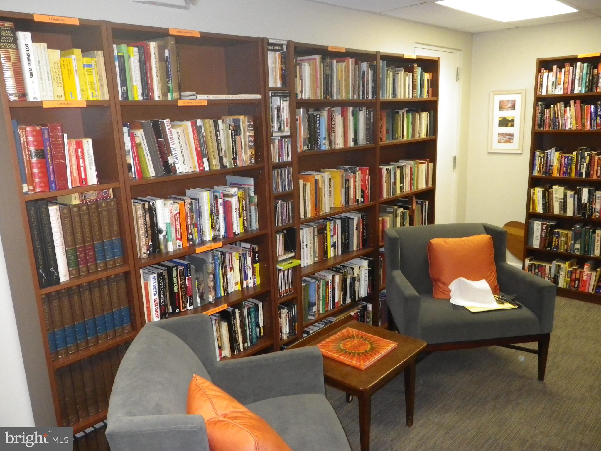 4643 Pine Street, Unit C411 Philadelphia, PA 19143 - Photo 46 of 63 a living room with large book shelf and a book shelf