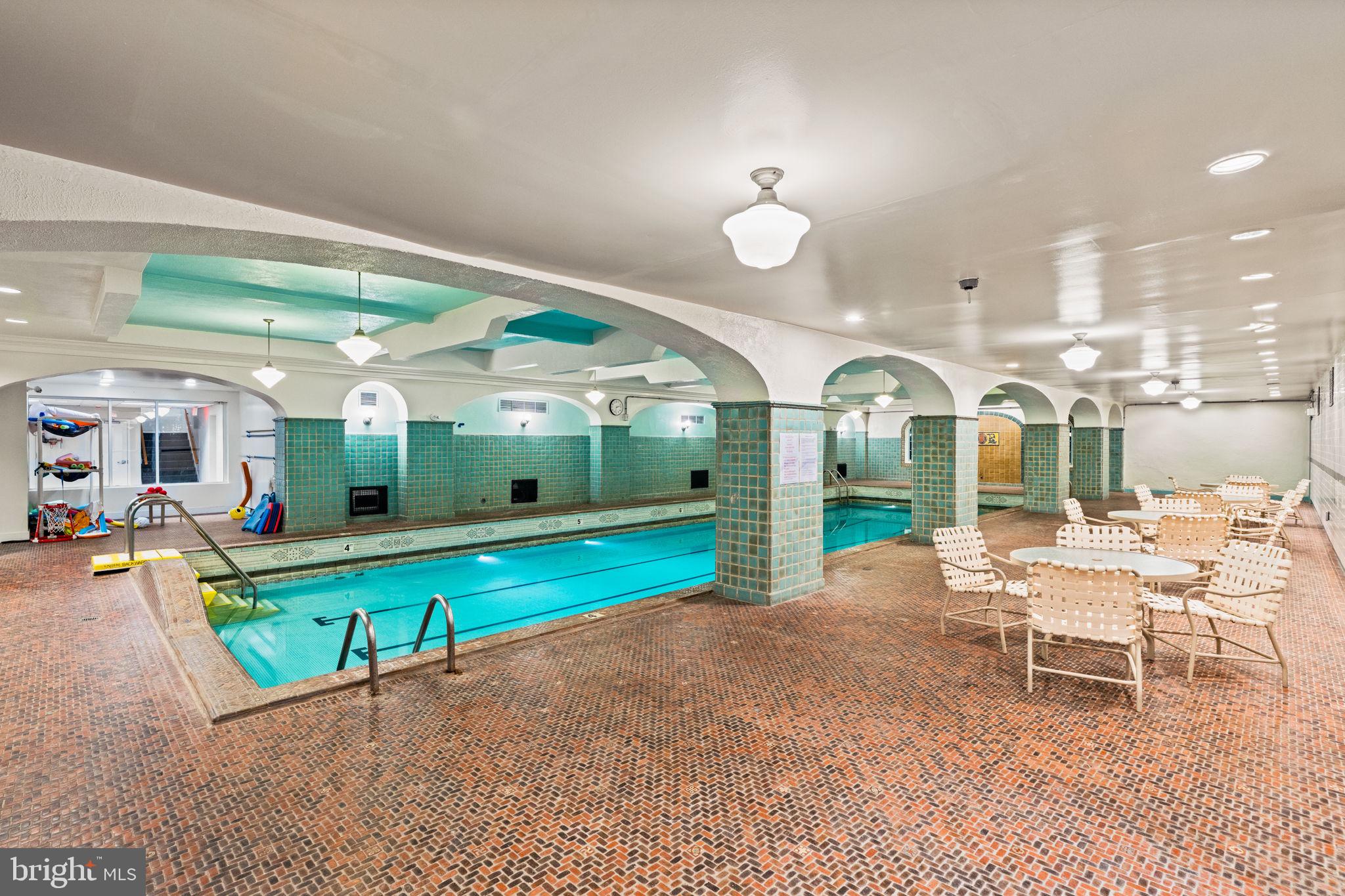 4643 Pine Street, Unit C411 Philadelphia, PA 19143 - Photo 50 of 63 a view of a chair and tables in the patio