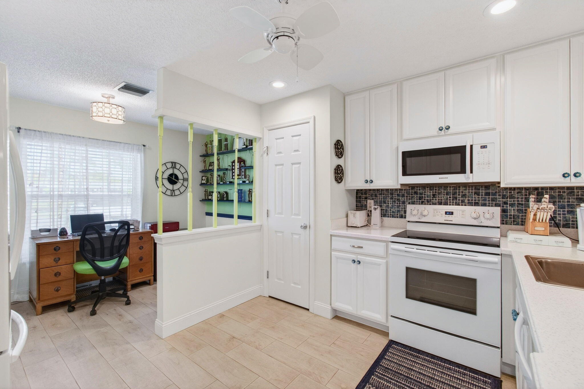 5452 Poppy Place, Unit D Delray Beach, FL 33484 - Photo 11 of 62 Open concept kitchen and mini desk area