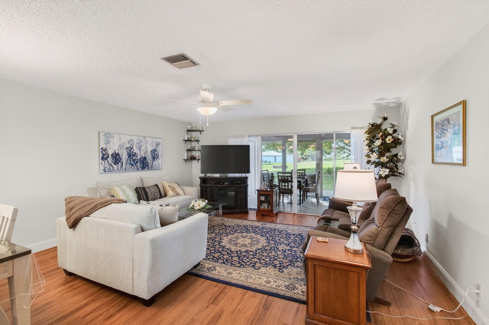 5452 Poppy Place, Unit D Delray Beach, FL 33484 - Photo 17 of 62 Living and enclosed lanai view (2)