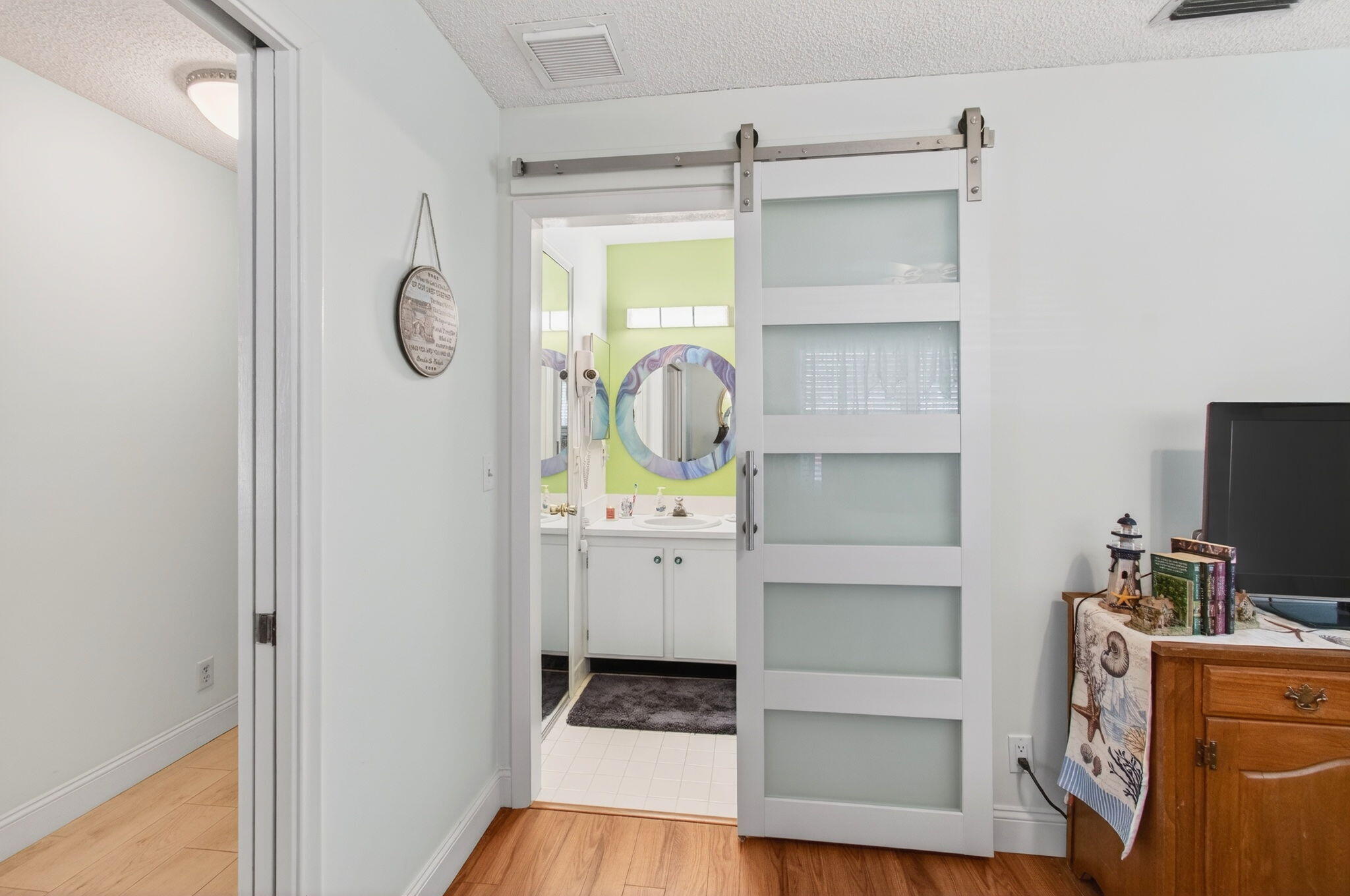 5452 Poppy Place, Unit D Delray Beach, FL 33484 - Photo 26 of 62 Updated barn door in guest bathroom