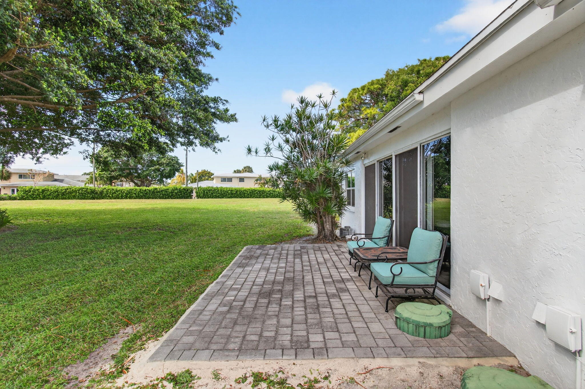 5452 Poppy Place, Unit D Delray Beach, FL 33484 - Photo 43 of 62 Private backyard patio with greenspace v