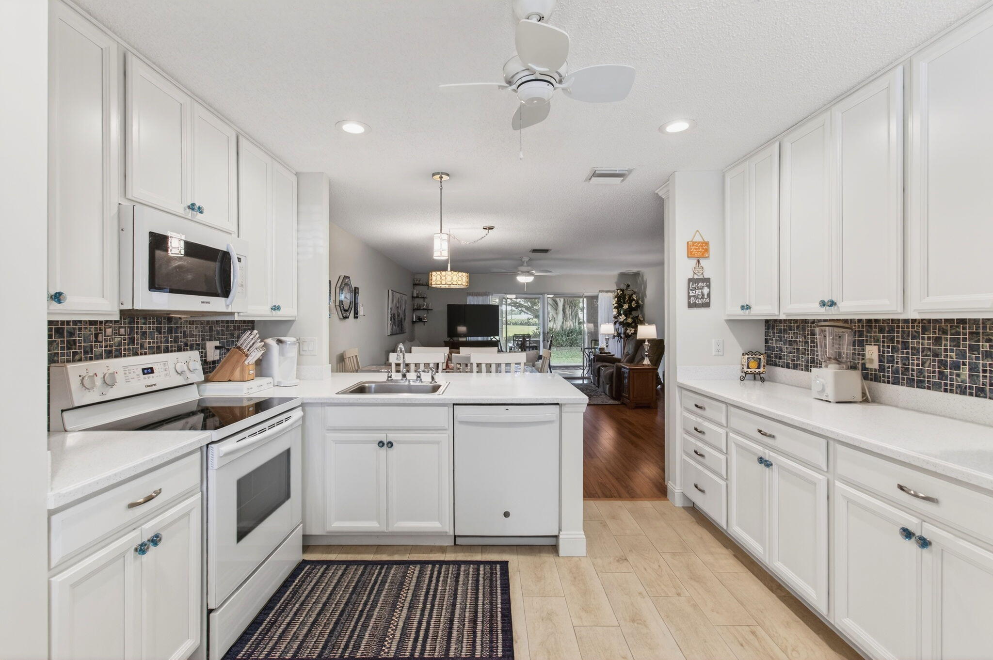 5452 Poppy Place, Unit D Delray Beach, FL 33484 - Photo 9 of 62 Open concept kitchen and mini desk area