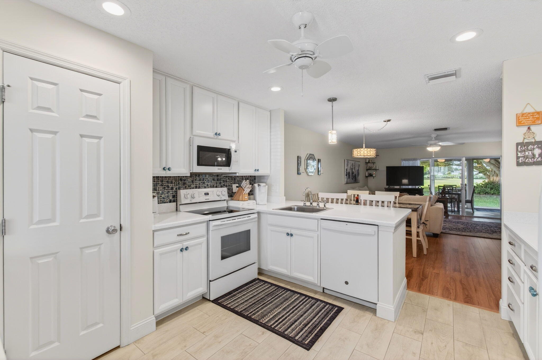 5452 Poppy Place, Unit D Delray Beach, FL 33484 - Photo 10 of 62 Open concept kitchen and mini desk area