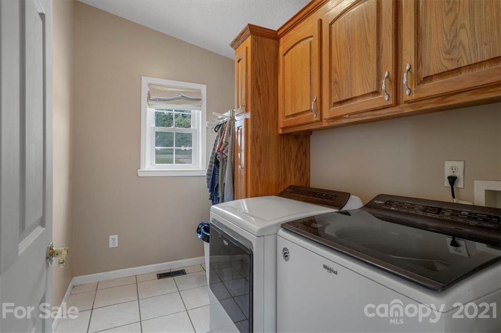 308 Kiser Road Bessemer City, NC 28016 - Photo 12 of 32 a utility room with dryer and washer