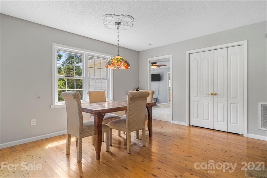 308 Kiser Road Bessemer City, NC 28016 - Photo 15 of 32 a view of a dining room with furniture window and wooden floor