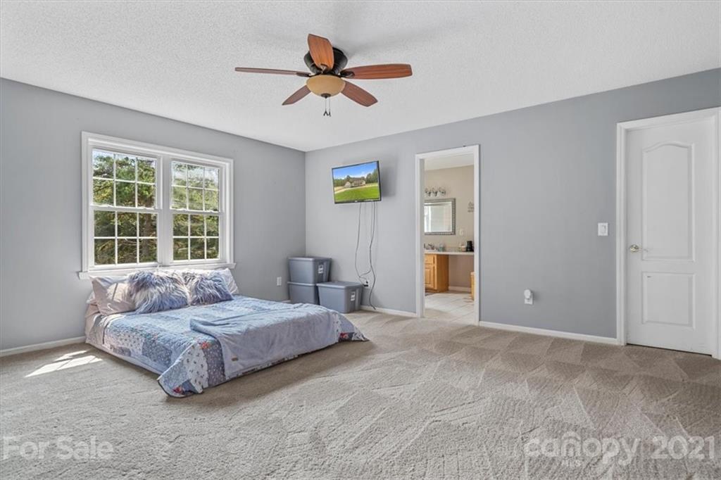 308 Kiser Road Bessemer City, NC 28016 - Photo 18 of 32 a living room with a bed furniture and a window