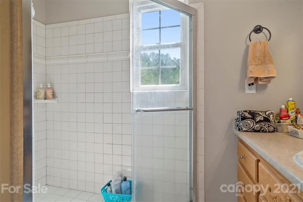308 Kiser Road Bessemer City, NC 28016 - Photo 19 of 32 a bathroom with a sink and a window