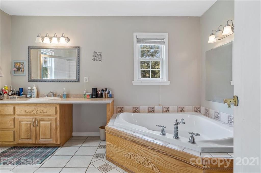 308 Kiser Road Bessemer City, NC 28016 - Photo 20 of 32 a spacious bathroom with a tub sink and glass door