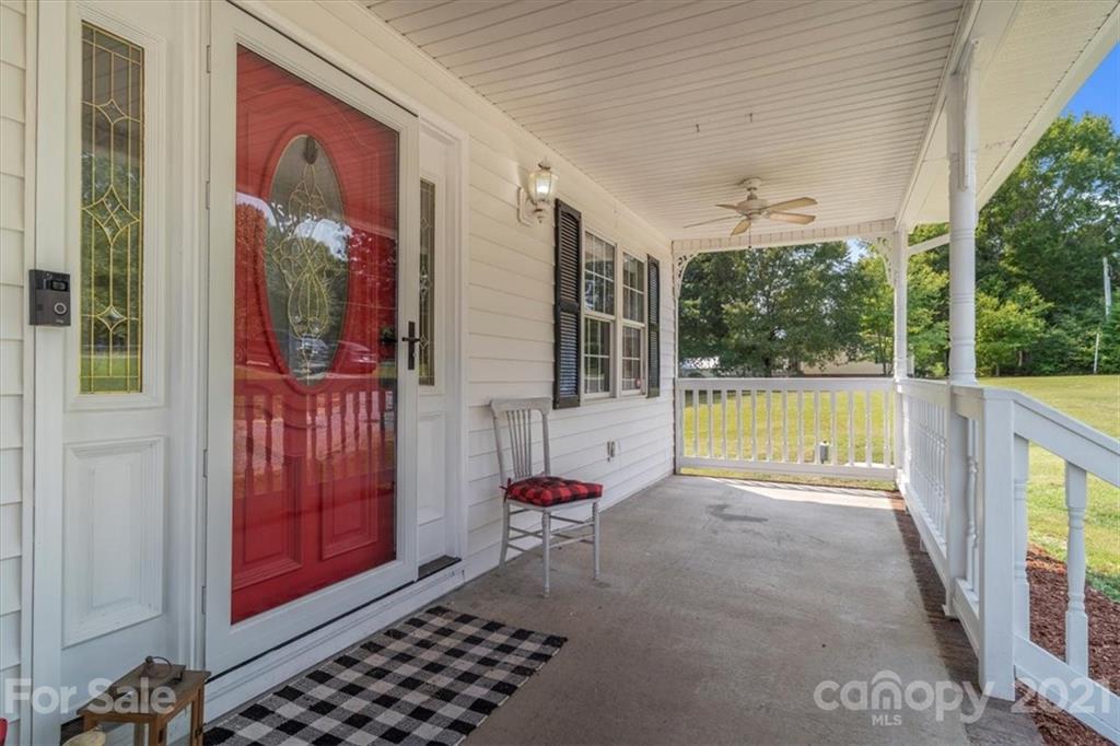308 Kiser Road Bessemer City, NC 28016 - Photo 3 of 32 a view of a porch with furniture and front door