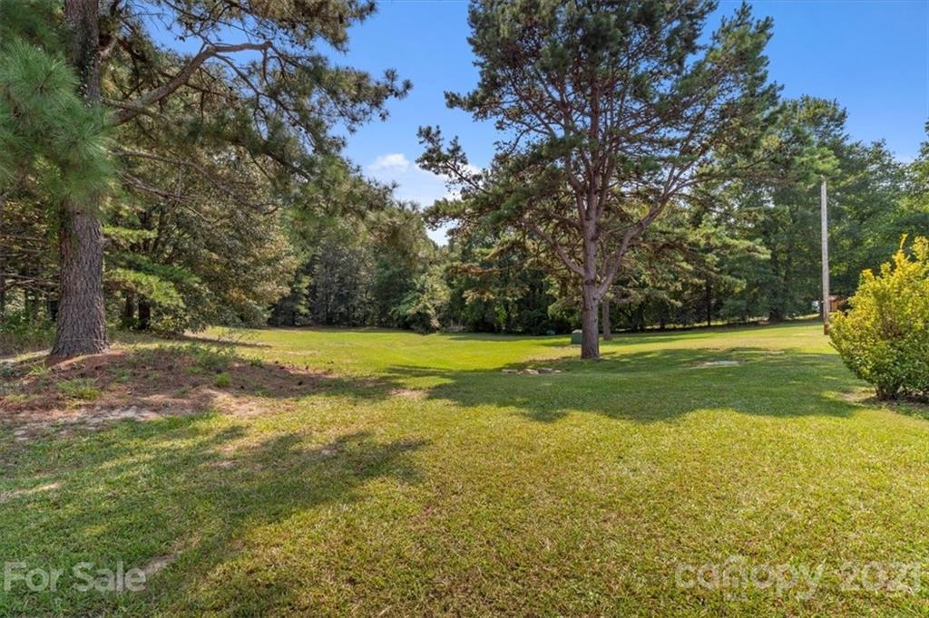 308 Kiser Road Bessemer City, NC 28016 - Photo 25 of 32 a view of a house with a yard
