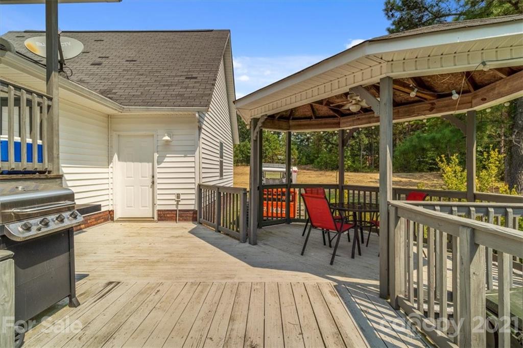308 Kiser Road Bessemer City, NC 28016 - Photo 28 of 32 a view of a balcony with chairs and wooden floor