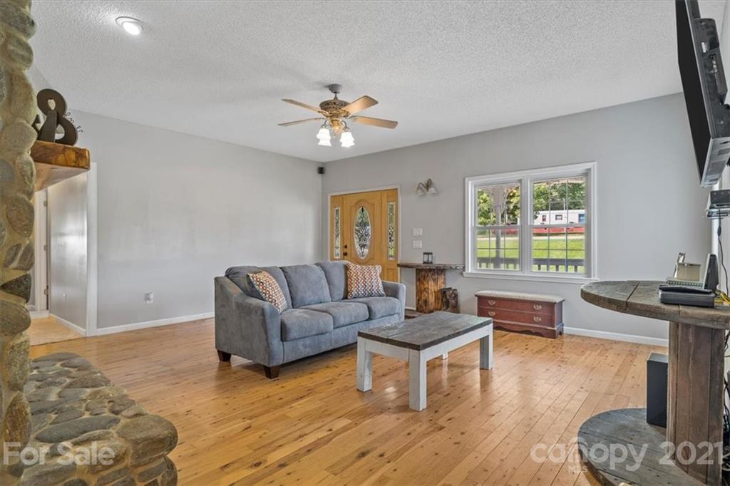 308 Kiser Road Bessemer City, NC 28016 - Photo 5 of 32 a living room with furniture and a wooden floor