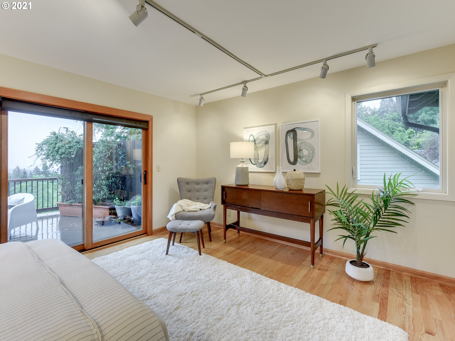 3630 Southwest Patton Road Portland, OR 97221 - Photo 16 of 29 a bedroom with furniture and a potted plant