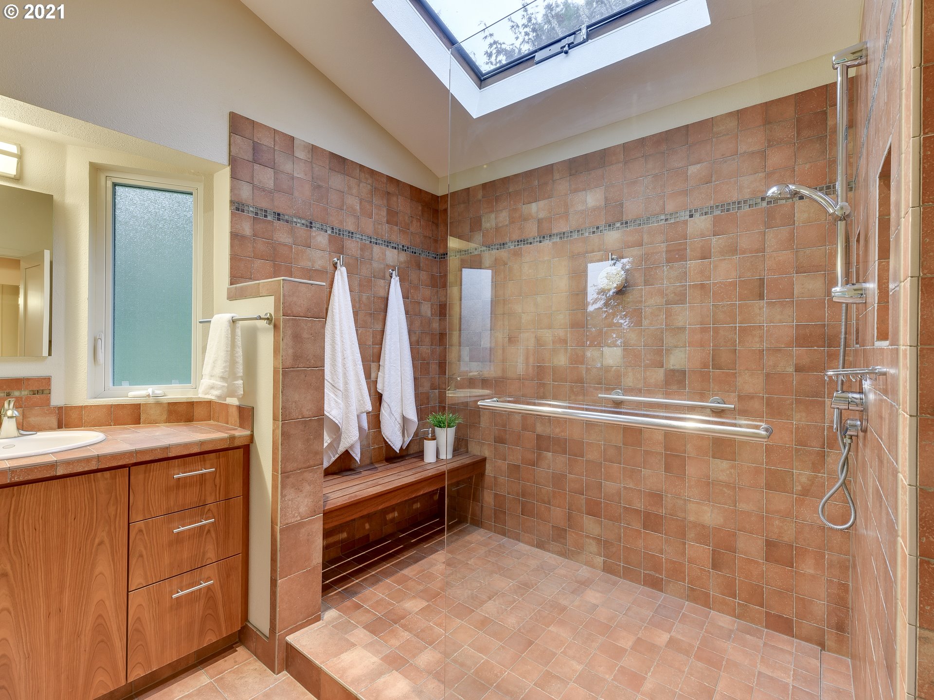 3630 Southwest Patton Road Portland, OR 97221 - Photo 17 of 29 a bathroom with a sink a toilet and shower