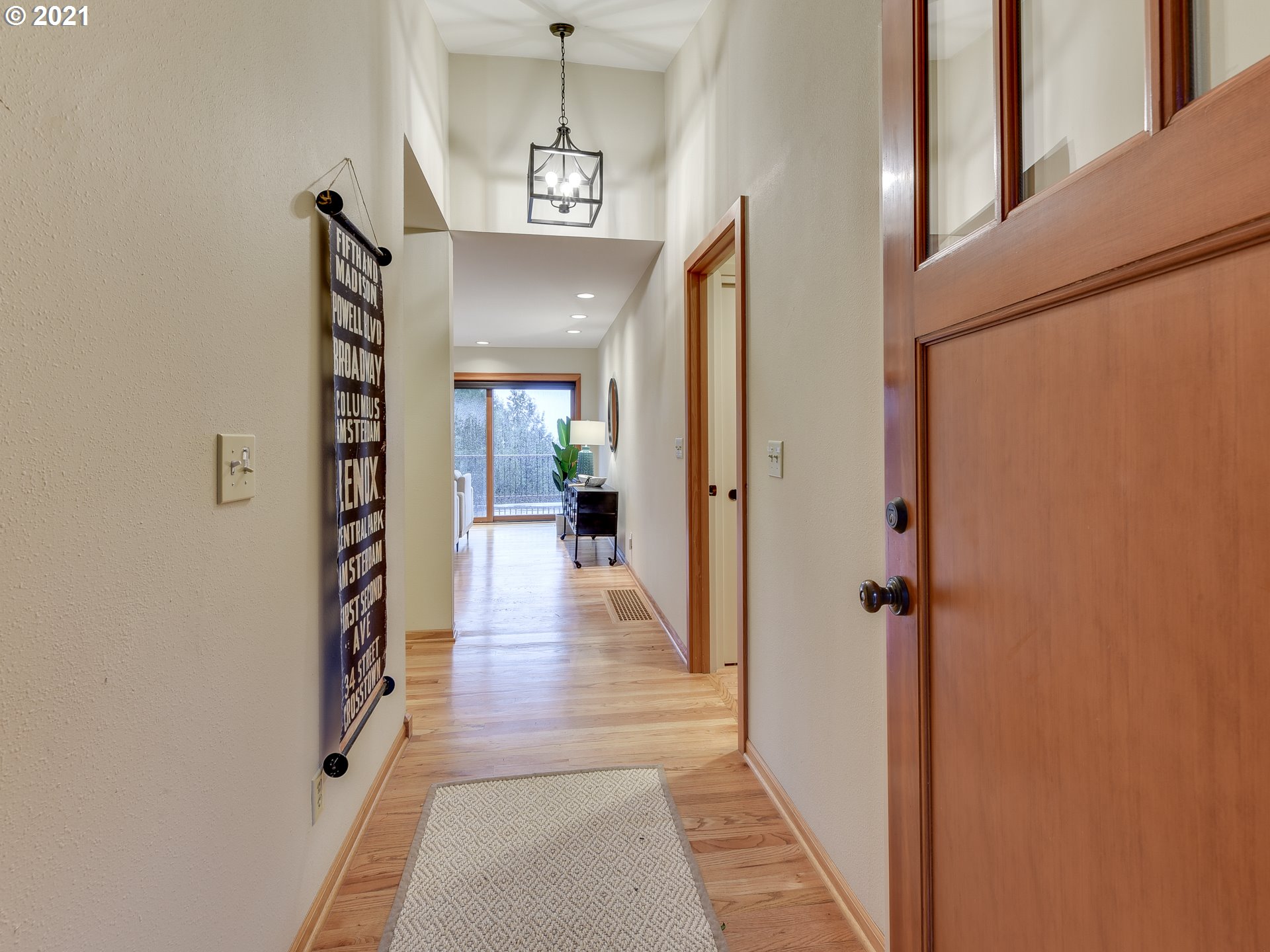 3630 Southwest Patton Road Portland, OR 97221 - Photo 2 of 29 a view of a hallway with a chandelier and living room