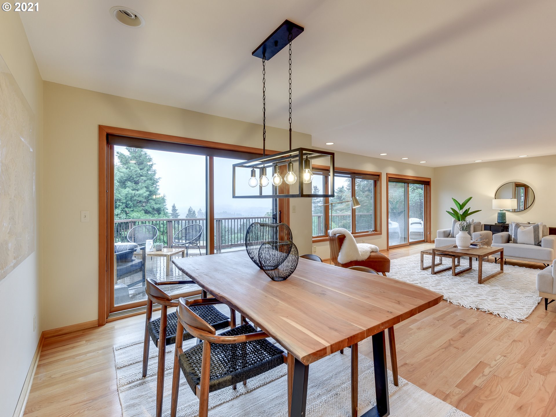 3630 Southwest Patton Road Portland, OR 97221 - Photo 7 of 29 a view of a dining room with furniture wooden floor and chandelier