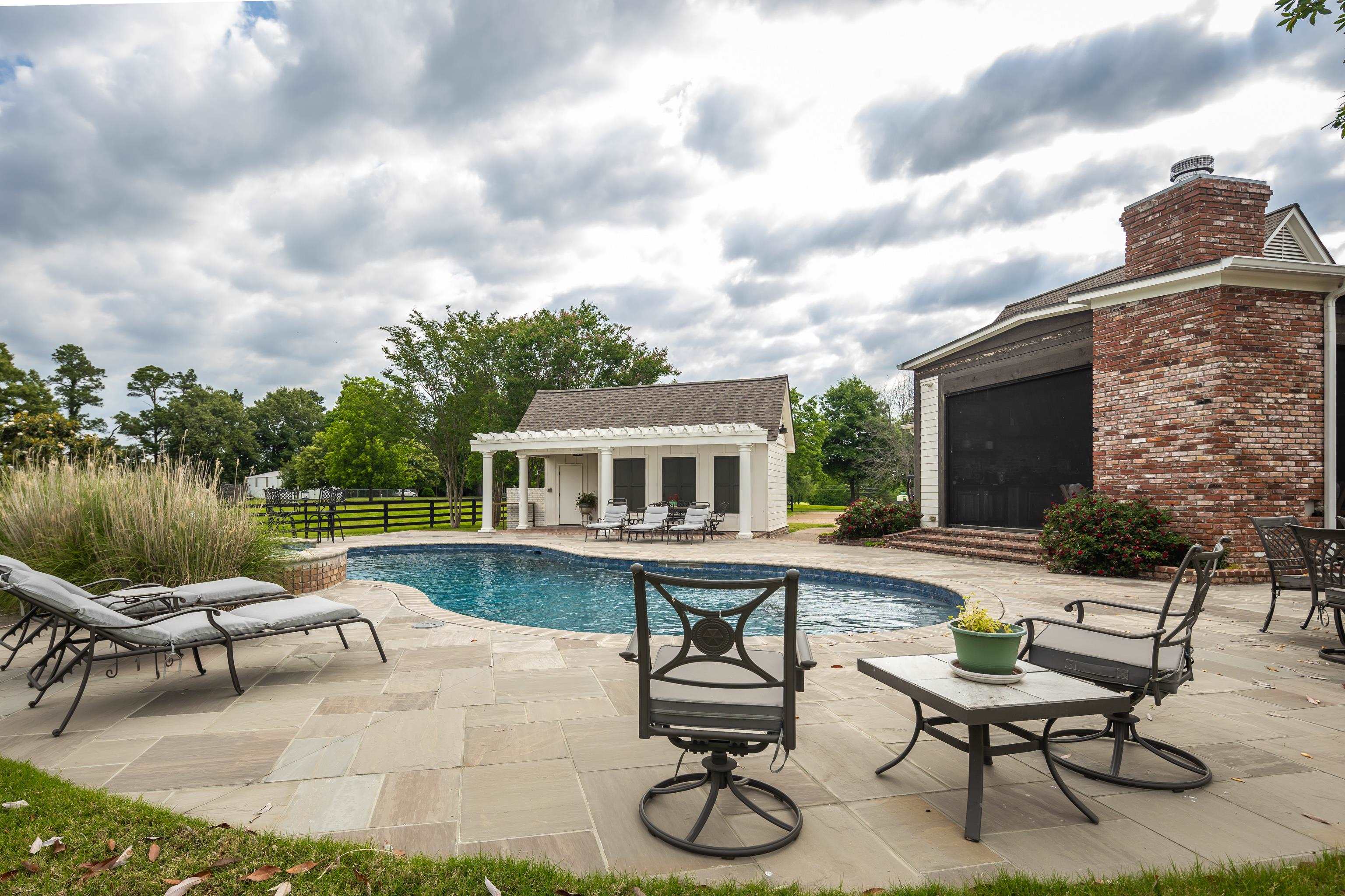 6085 Yum Yum Road Somerville, TN 38068 - Photo 31 of 40 a view of a house with pool and chairs