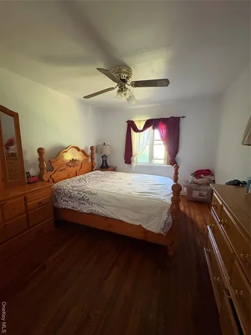 a bedroom with a bed and closet