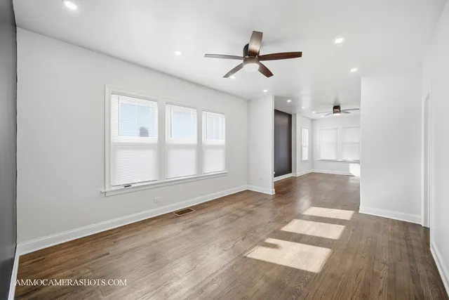 a kitchen with stainless steel appliances granite countertop a stove a refrigerator and a microwave