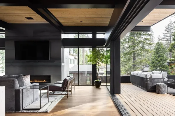 a kitchen with stainless steel appliances a stove a table and chairs