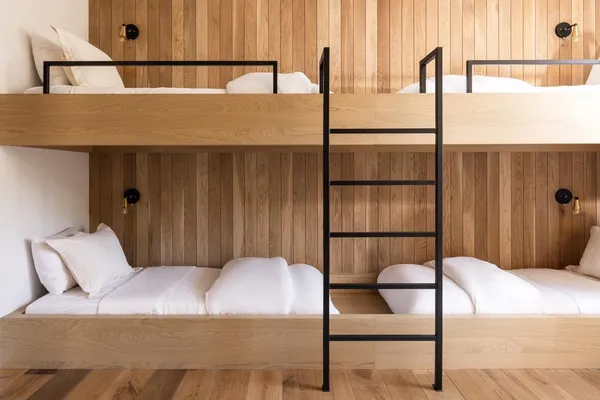 a bathroom with a sink a toilet a mirror and shower