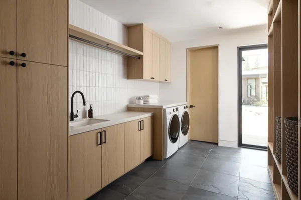 a view of a patio with table and chairs with wooden floor and fence