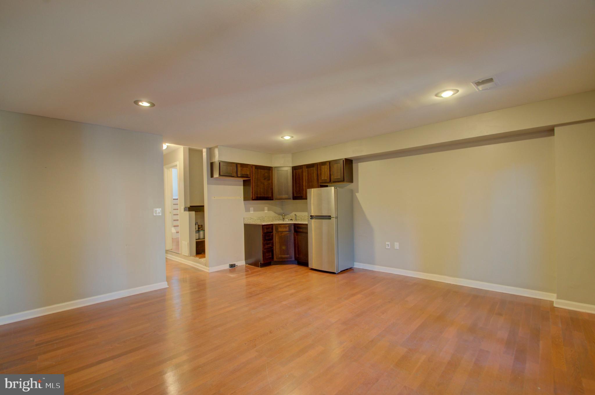 1159 5th Street Northeast Washington, DC 20002 - Photo 28 of 43 Spacious basement with sink and bar