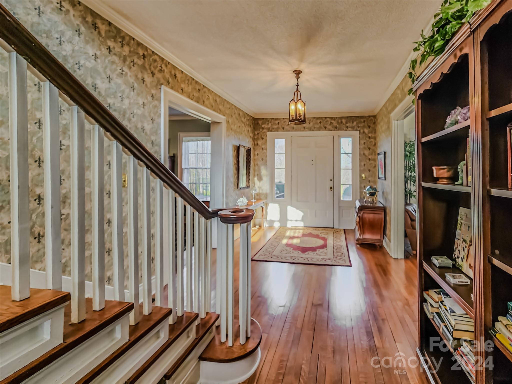 535 North Washington Street Rutherfordton, NC 28139 - Photo 11 of 48 a view of a living room and entryway with wooden floor