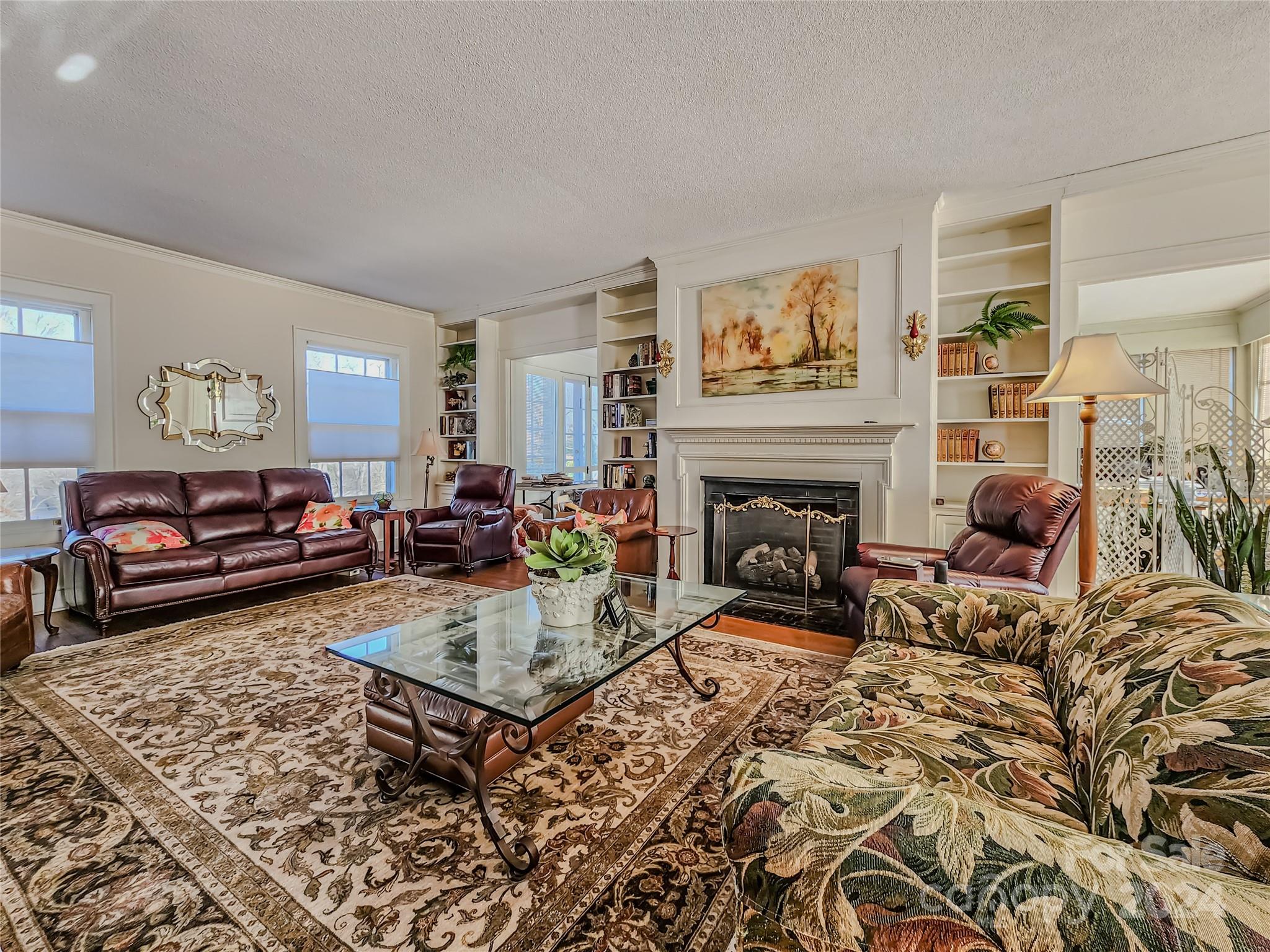 535 North Washington Street Rutherfordton, NC 28139 - Photo 12 of 48 a living room with furniture a rug and a fireplace