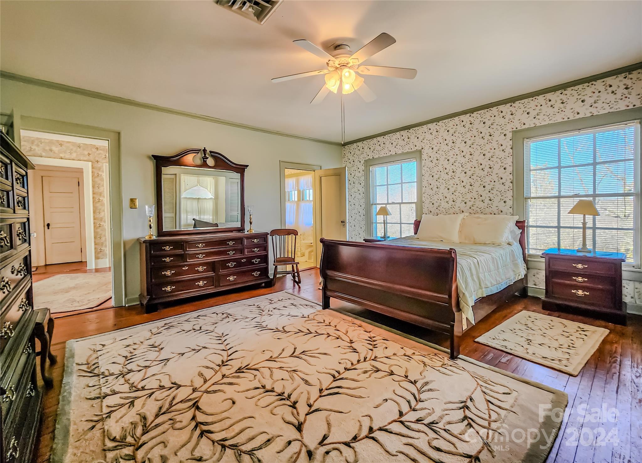 535 North Washington Street Rutherfordton, NC 28139 - Photo 29 of 48 a bedroom with a bed and a dresser next to a large window
