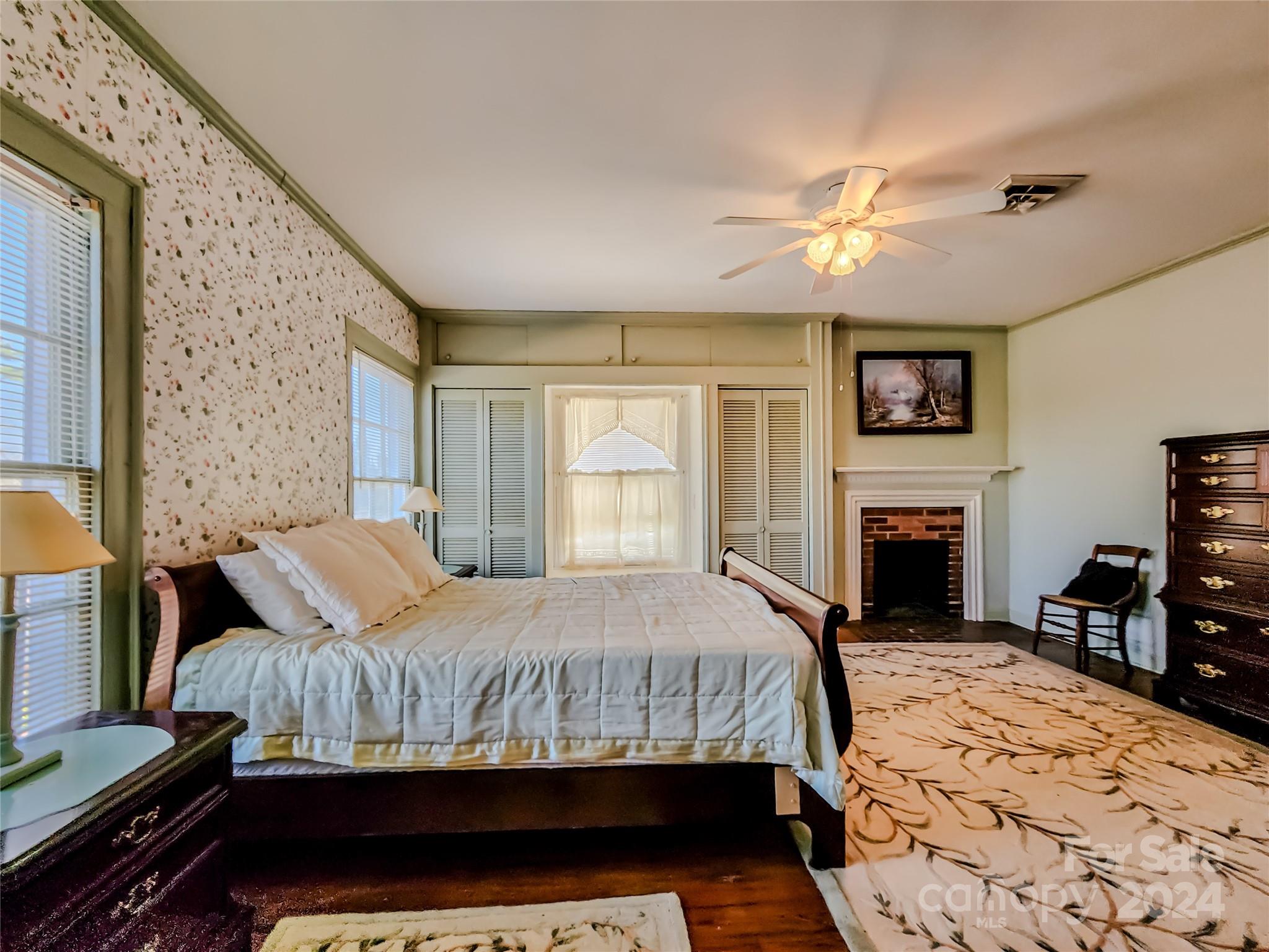 535 North Washington Street Rutherfordton, NC 28139 - Photo 30 of 48 a bedroom with a bed and a fireplace