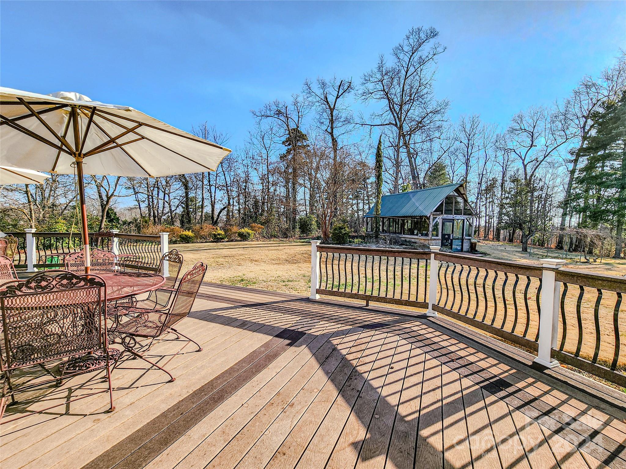 535 North Washington Street Rutherfordton, NC 28139 - Photo 7 of 48 a view of balcony with wooden floor and outdoor seating