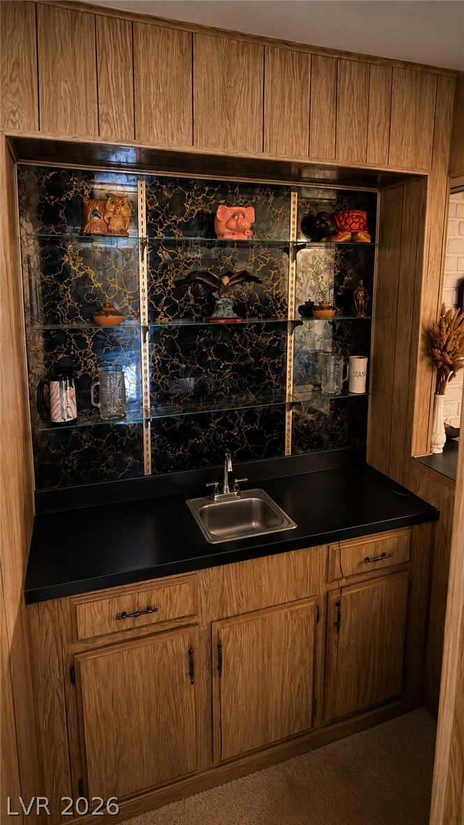 2764 Rainer Court Las Vegas, NV 89142 - Photo 4 of 13 A classic bar setup features ample storage and a convenient sink, making for a comfortably perfect place for entertaining.