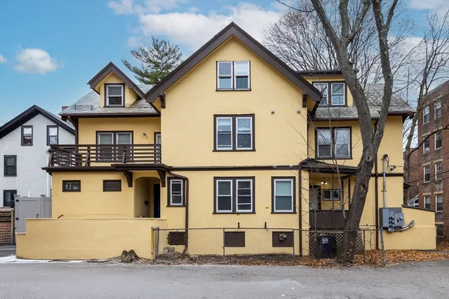 a view of a big house with large windows