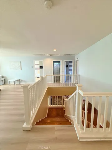 a view of staircase with white walls